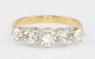 An 18ct yellow gold 5 stone diamond ring approx. 1.5ct size O