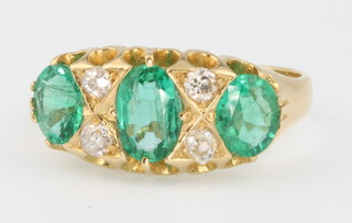 An 18ct yellow gold emerald and diamond Victorian style ring size N 1/2