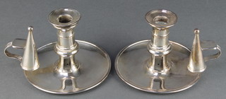 A pair of 19th Century silver plated chamber candlesticks with snuffers 
