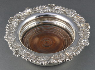 A 19th Century silver plated champagne coaster with floral and scroll rim 