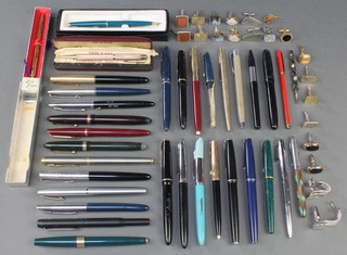 Minor cufflinks and a quantity of fountain pens and pencils