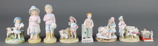 A 19th Century Continental porcelain match striker in the form of a standing boy 4 1/2" and 7 others