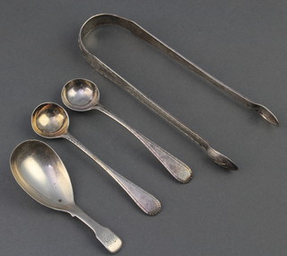 A George IV silver caddy spoon of plain form, 2 mustard spoons and a pair of nips 65.9 grams