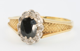 An 18ct yellow gold sapphire and diamond ring size P 