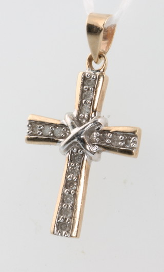 A 9ct yellow gold diamond set cross pendant 