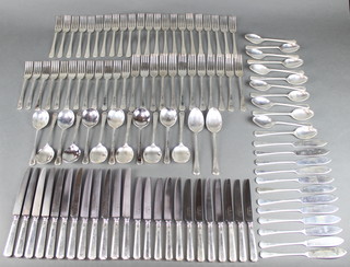 A good Art Deco style contemporary canteen of silver cutlery comprising 12 soup spoons, 12 dessert spoons, 2 serving spoons, 12 small forks, 12 dinner forks, 11 dessert forks, 11 fish forks, 12 fish knives, 10 small table knives with silver handles, 12 large table knives with silver handles, maker William Hutton  & Sons Ltd, mixed dates 5281 grams 