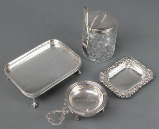 A silver plated rectangular card tray, a ditto dish, plated tea strainer and stand and a mounted pickle jar