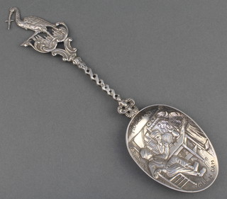 A Dutch silver spoon with heron finial, twist stem and Inn scene 8.25", 60 grams