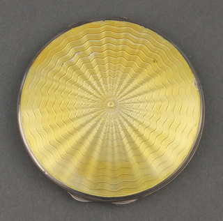 A silver and yellow guilloche enamel compact Birmingham 1940 
