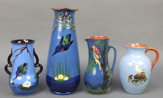 A Torquay vase decorated with a Kingfisher 5", do. with open handles 8", a jug decorated with a parrot 6" and a jug decorated with a seagull 7"  