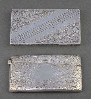 An Edwardian style chased silver plated card case with musical notes and scroll decoration 3 1/4" x 1 3/4" together with a Victorian silver card case with scrolled decoration Birmingham 1897, 115 grams
