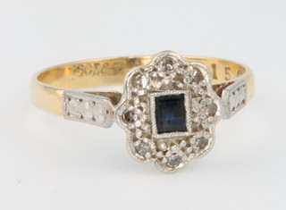 An 18ct yellow gold diamond and sapphire ring, size N 