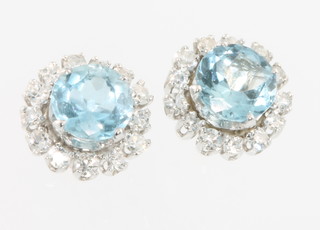 A pair of 18ct white gold aquamarine and diamond ear studs 