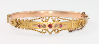 A Victorian 9ct yellow gold ruby and diamond  Etruscan style bangle 7.9 grams 