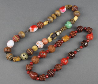 A Chinese glass horn and hardstone bead necklace, a Japanese ditto with carved mask beads and hard stones 