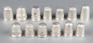 An Edwardian silver thimble Birmingham 1909 and 12 other thimbles