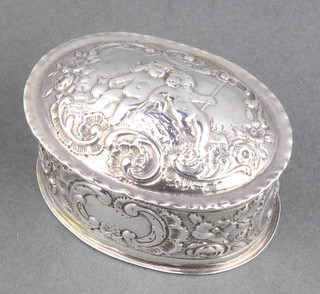 A modern oval silver repousse trinket box decorated with cavorting cherubs Birmingham 1978, 50 grams 2 1/2" 