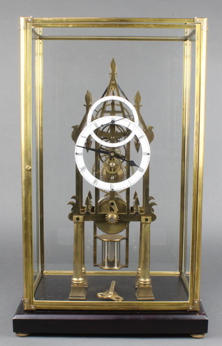 A Victorian style fusee skeleton clock with enamelled dial and subsidiary minute dial, contained in a gilt and glazed case 21 1/2"h x 12"w x 8"d 