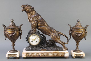 A 19th Century French marble and spelter 3 piece clock garniture, the 8 day striking mantel clock with enamelled dial and Arabic numerals marked Frappier 5 Rue de Seine Ivy, surmounted by a spelter figure of a standing wounded lion,  together with a matching pair of lidded urns (one af)