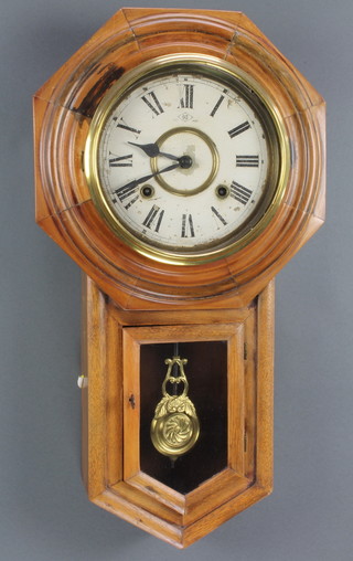 A striking wall clock with painted dial and Roman numerals contained in a walnut finished case 