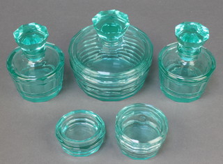 An Art Deco cyan glass dressing table set with powder bowl and lid, 2 scent bottles and stopper, a box and cover and a box base 