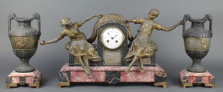 A French Art Deco 2 colour marble clock garniture with striking mantel clock supported by 2 figures of girls, the enamelled dial with Arabic numerals contained in a 2 colour marble case together with a pair of urns 