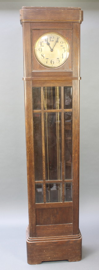 A 1930's chiming longcase clock with 10" silvered dial and Arabic numerals contained in an oak and bevelled glass case 84" 