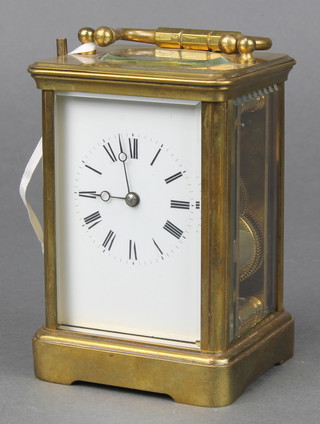 A French 19th Century 8 day striking carriage clock with enamelled dial and Roman numerals contained in a gilt metal case 4" x 3" x 3" 