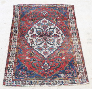 A red, blue and white ground Persian Bakhtiari rug with central medallion 79" x 54" 