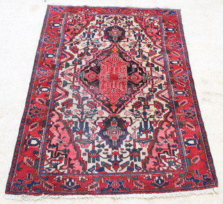 A red and blue ground Bakhtiari rug with central medallion 90" x 62" 