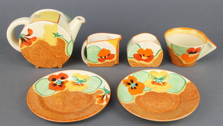 A Clarice Cliff  Bizarre Nasturtium part tea set comprising teapot and lid, cream jug, sugar bowl, tea cup, saucer and plate 