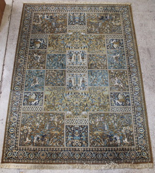 A green ground Persian style rug decorated hunting scenes 135" x 98" 