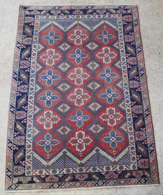 A Turkish tan and blue ground rug with 18 stylised stars to the centre 115" x 78" 