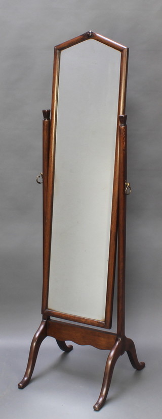 A 1920's cheval mirror contained in an oak frame  60"h x 15 1/2"w x 19 1/2"d 
