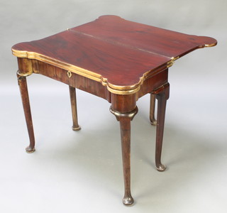 A Georgian mahogany triple top card table with tea table, the card table fitted guinea wells and candle stands, raised on club supports 28"h x 34"l x 17"d 