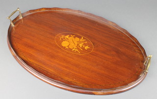 An oval Edwardian inlaid mahogany twin handled tea tray decorated musical trophies 24"l x 15"w 