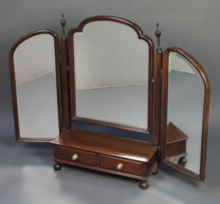 An Edwardian triple plate arch shaped dressing table mirror contained in a mahogany swing frame, the base fitted a drawer 32"h x 42 1/2"w x 7 1/2"d 