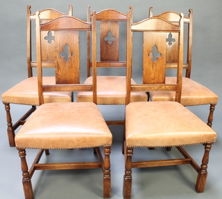 Brights of Nettlebed, a set of 6 carved oak slat and bar back dining chairs, the seats upholstered in leather, raised on turned and block supports with H framed stretcher 
