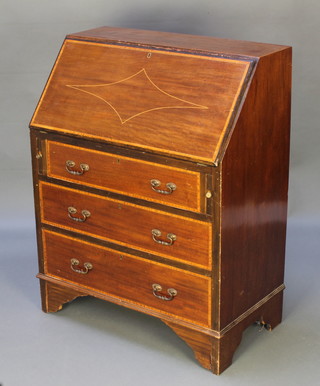 An Edwardian inlaid mahogany bureau, the fall front revealing a fitted interior above 3 long graduated drawers, raised on bracket feet 38"h x 30"w x 17"d 