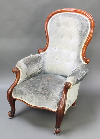 A Victorian mahogany show frame armchair upholstered in blue buttoned material, raised on cabriole supports