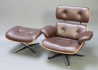 An Eames style armchair with rosewood finish and brown buttoned back hide, complete with matching stool (as new) 