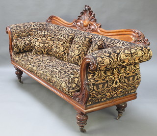 A William IV carved show frame mahogany sofa with carved and pierced back, raised on turned supports 44"h x 88"w x 26"d 