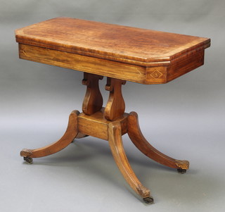 A Regency mahogany card table with crossbanded top inlaid satin and ebony stringing on lyre shaped supports with square base and carved scrolled feet 28"h x 35 1/2"w x 18"d 