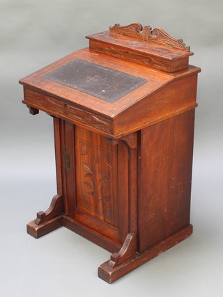 An Edwardian carved walnut Davenport the back fitted a stationery box with cupboard 34"h x 21"w x 19"d 