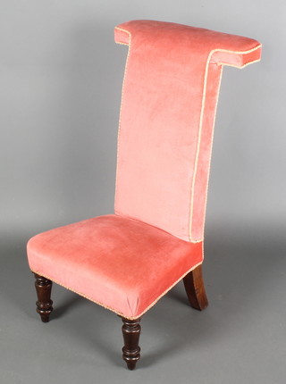 A Victorian prie-dieu chair upholstered in pink dralon