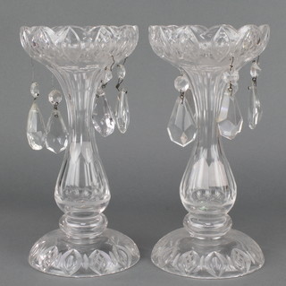 A pair of Victorian waisted clear glass lustres and drops 