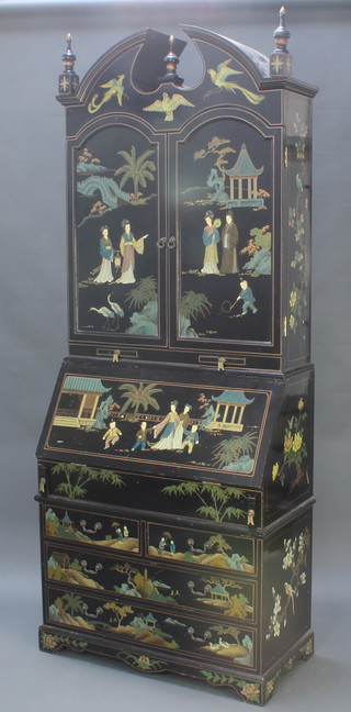 A chinoiserie style black lacquered bureau bookcase, the upper section with broken swan neck pediment, the interior fitted pigeon holes and drawers above 2 short drawers, the fall front revealing a stepped fitted interior above 2 short and 2 long drawers 88 1/2"h x 35"w x 17 1/2"d 
