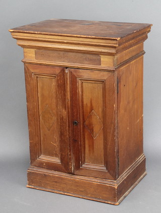 A cedar table top cigar cabinet with moulded cornice and fitted tray enclosed by panelled doors 18 1/2" x 13"w x 10"d 