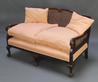 A mahogany single cane 3 piece bergere suite comprising 2 seat settee, 2 armchairs raised on cabriole paw supports 33"h x 53"l x 30"d 
