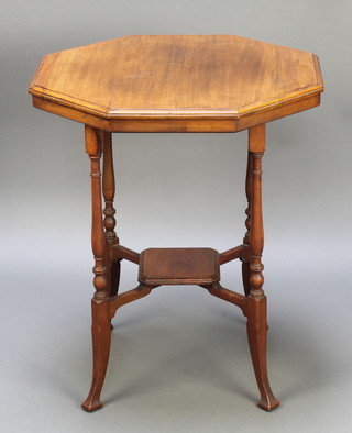 An Edwardian octagonal walnut 2 tier occasional table raised on turned supports 28"h x 23 1/2" x 24"d 
